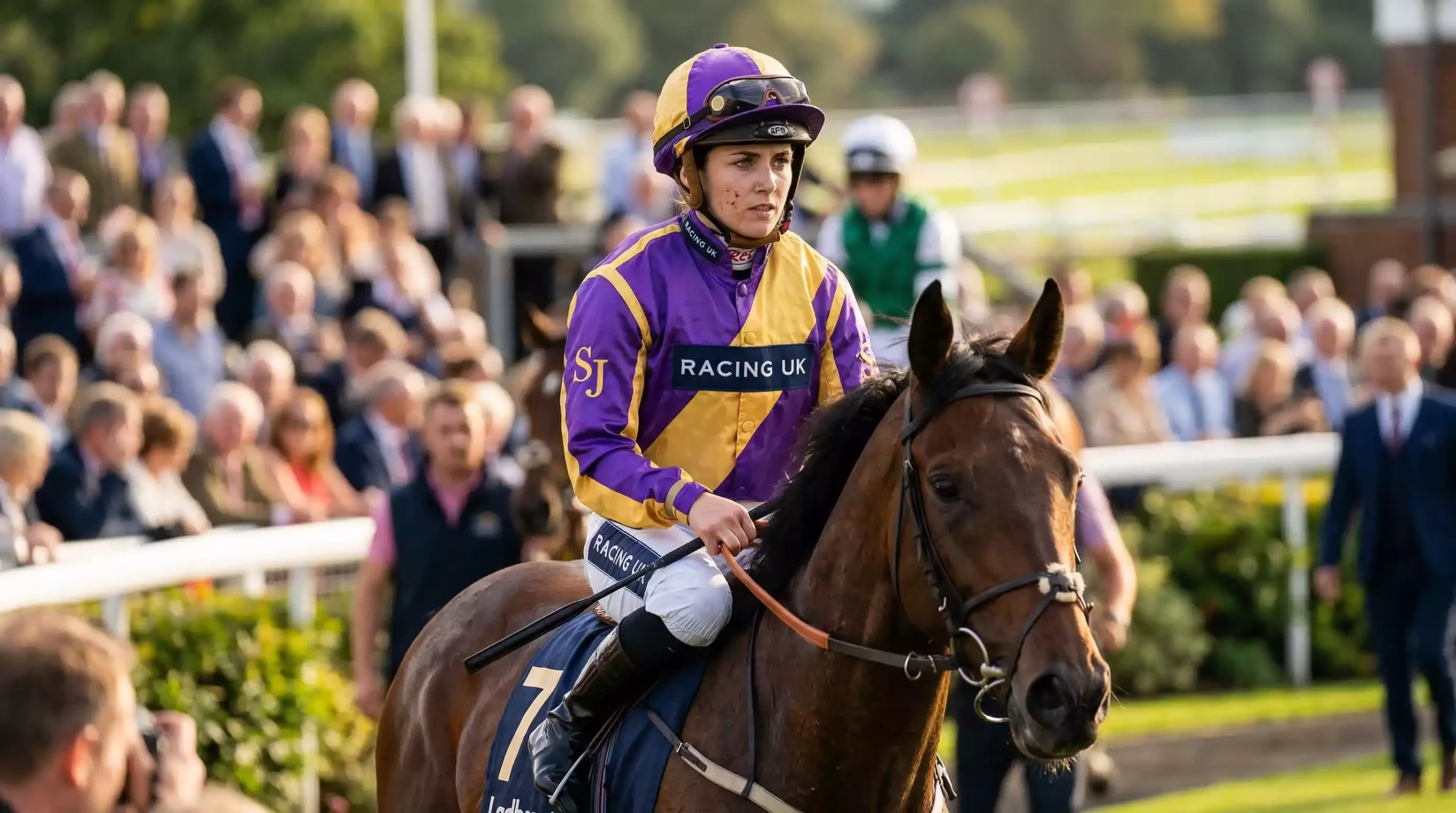 Jockey riding thoroughbred horse in UK racing